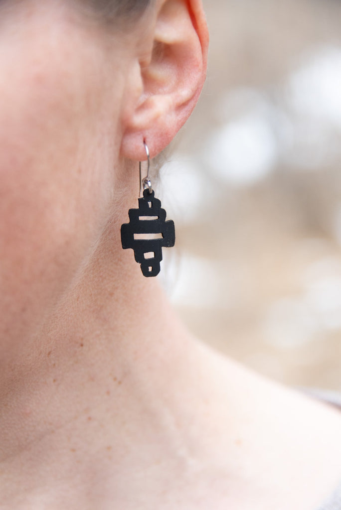 WCC 1" rubber earring made with stainless steel findings. inspired by the stupas found in Mustang, Nepal.
