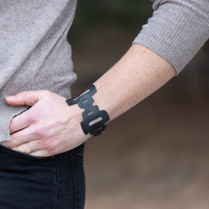 Open image in slideshow, WCC bracelet is made from upcycled bike tubes and closes with a 3D printed recycled plastic cufflink. This bracelet is inspired by the Stupas in Mustang, Nepal. 
