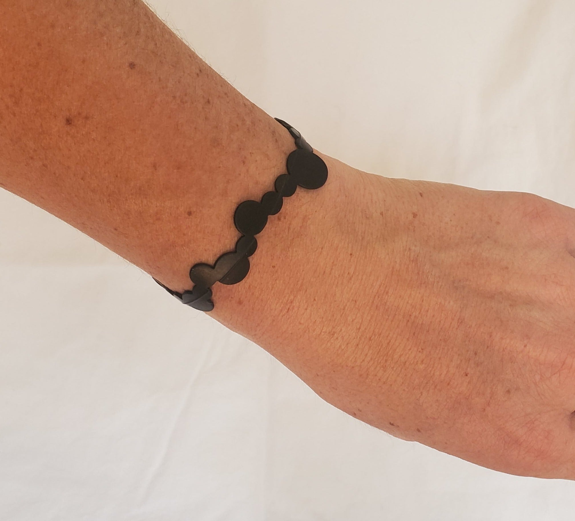 River Bubbles rubber bracelet is inspired by the water bubbles that lazily flow downstream. Upcycled, waterproof and lightweight rubber adventure jewelry.
