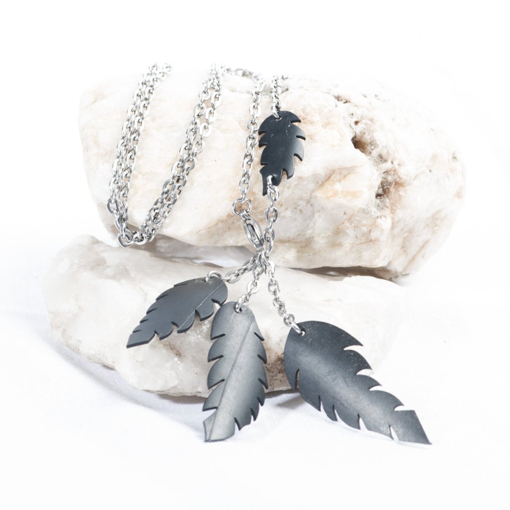 a-symmetrical feather necklace
