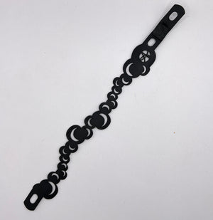 Let your imagination fly up to the moon with this many moons rubber bracelet.  The bracelet is edgy and looks like a tattoo from afar. It is made from up-cycled bicycle inner tubes, made to order in the USA with a recycled 3-d filament printed link.  2 sizes, 3 options within each. 